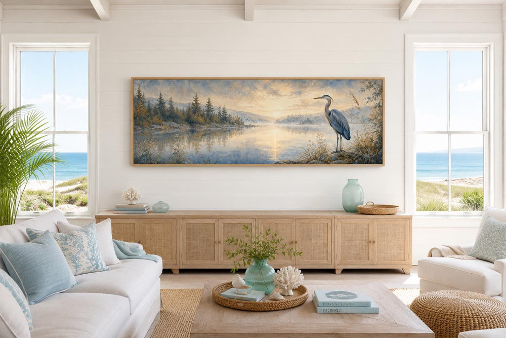 Long horizontal canvas art of a blue heron by a misty lake at dawn in a coastal living room.