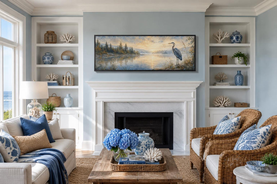 Long horizontal canvas wall art of a blue heron by a misty lake at dawn above a white fireplace.