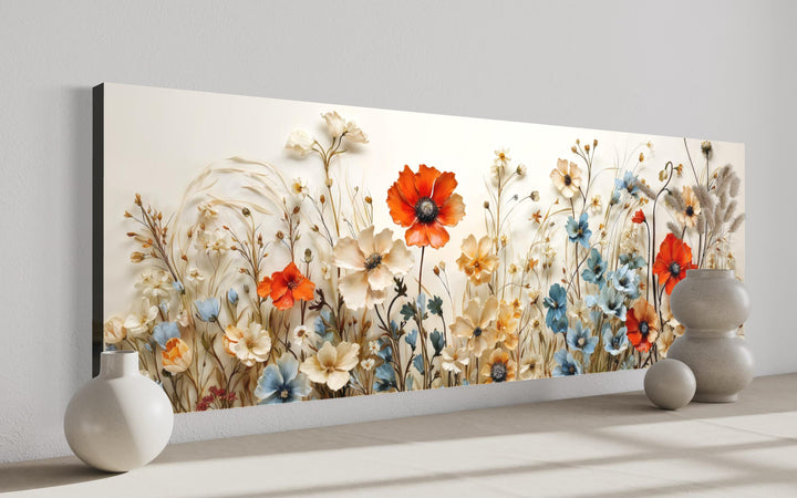 Wide horizontal canvas wall art featuring red poppies, blue blossoms, and wildflowers.