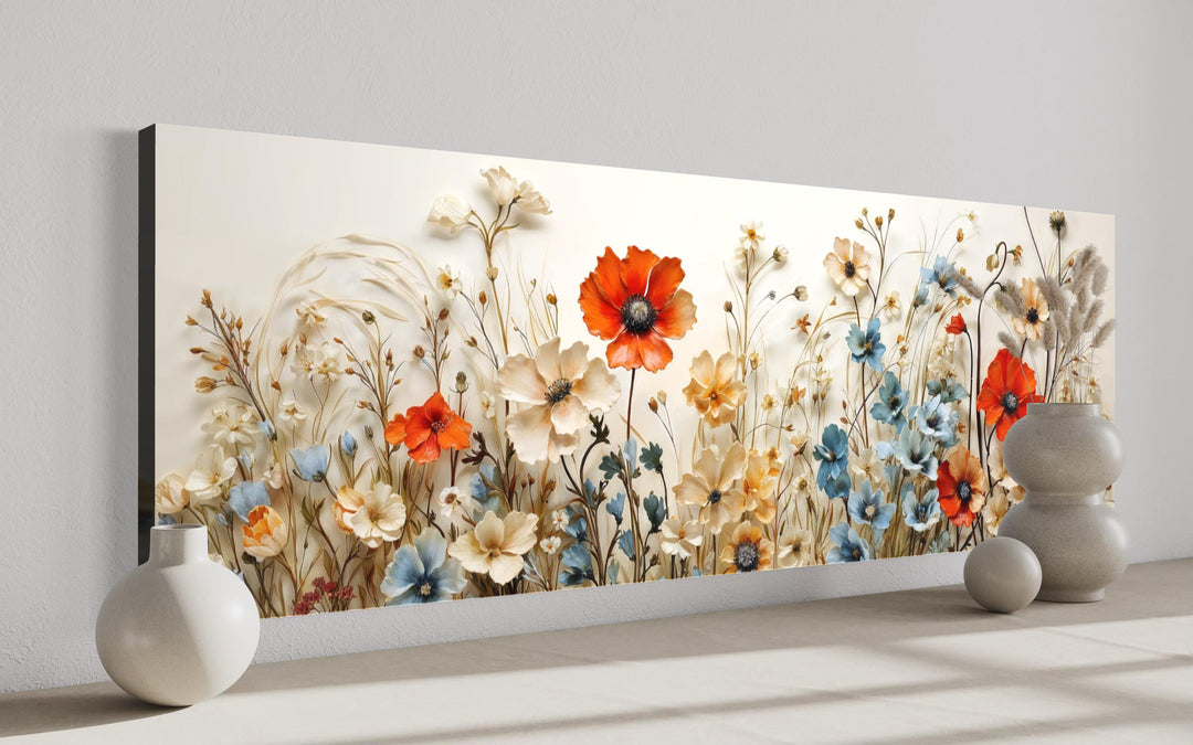 Long horizontal canvas wall art featuring a vibrant meadow of poppies and blue wildflowers.