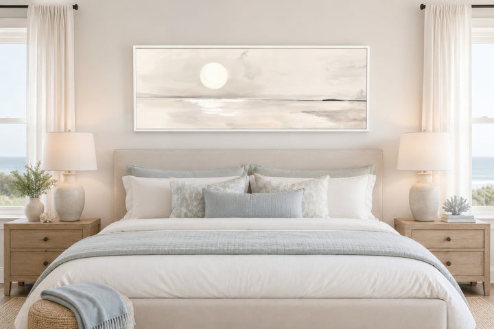 Long horizontal neutral coastal landscape wall art with a moon above a bed in a serene bedroom.