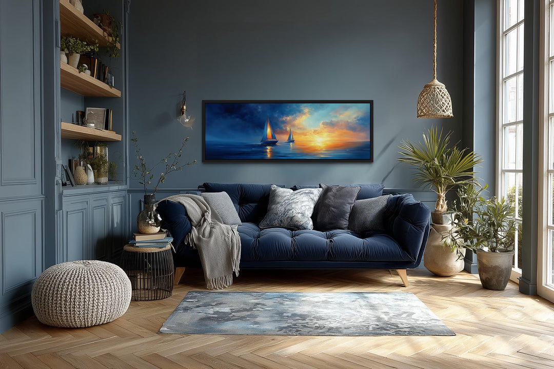 Long horizontal canvas wall art of sailboats on a calm ocean during a vibrant sunset.