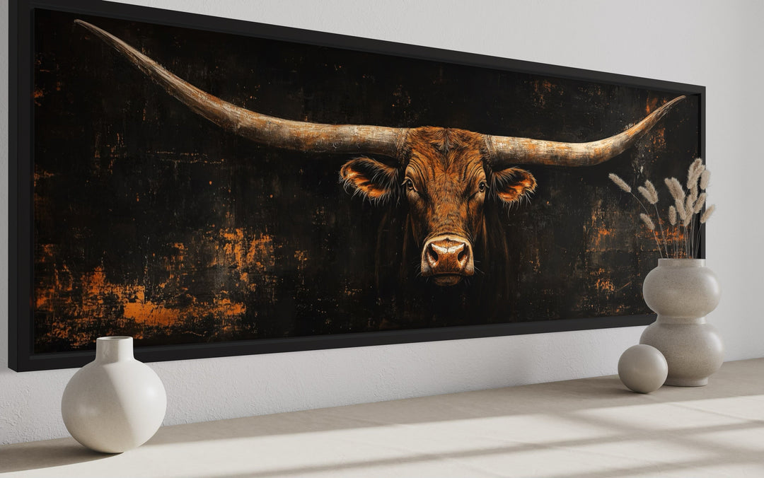 Long horizontal canvas wall art featuring a Texas longhorn bull head on a rustic black background.