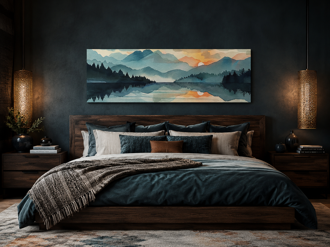 Long horizontal watercolor mountain lake sunset canvas wall art hanging above a dark wood bed.