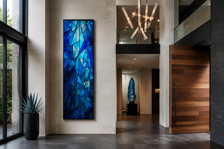 Long narrow navy blue kaleidoscope mosaic abstract vertical framed canvas wall art in a modern home.