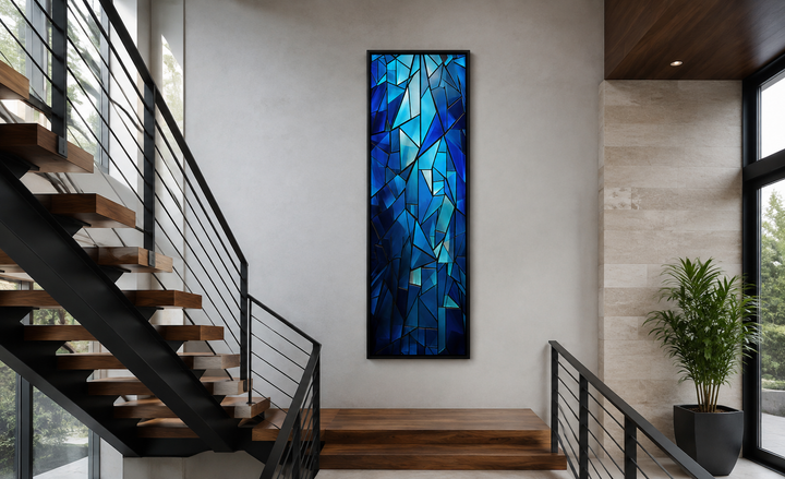 Long narrow vertical framed canvas with a navy blue kaleidoscope mosaic abstract pattern.