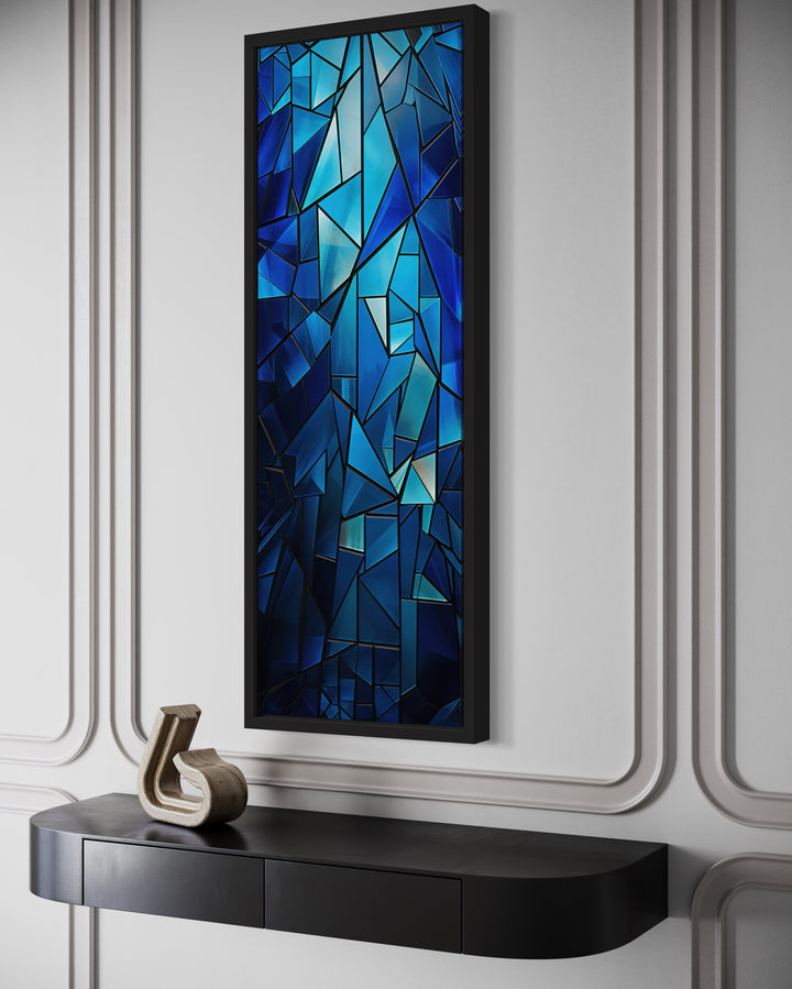 Vertical framed canvas wall art with a navy blue kaleidoscope mosaic abstract pattern.