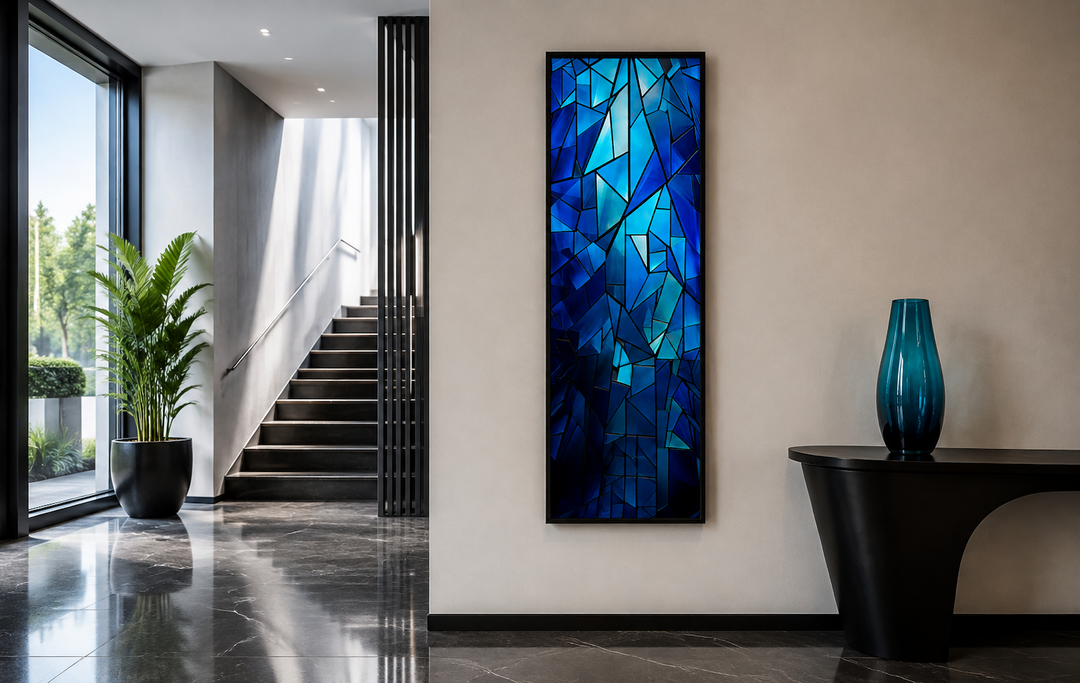 Long narrow vertical framed canvas wall art with a navy blue kaleidoscope mosaic abstract design.