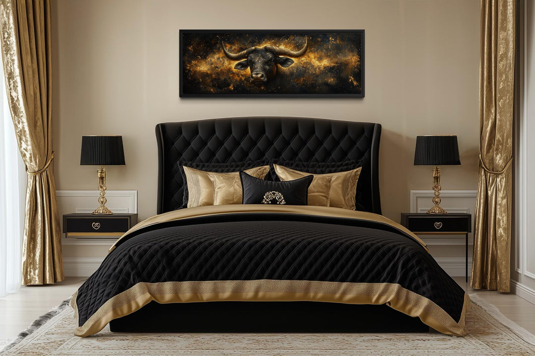 Long horizontal black and gold bull artwork against a celestial background.