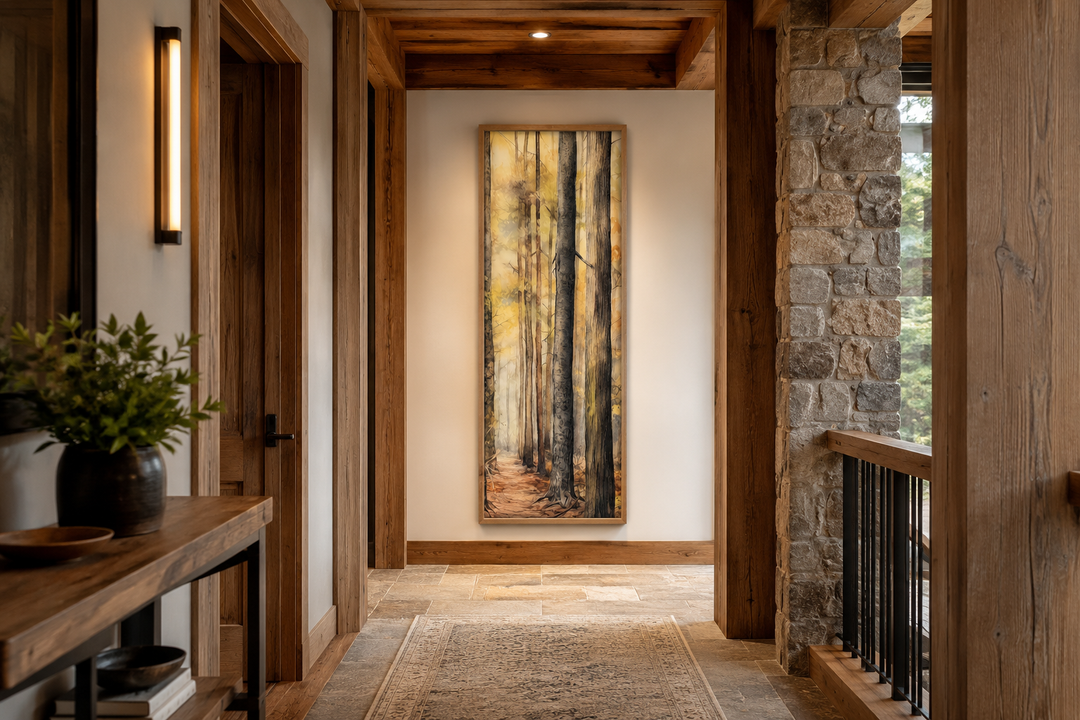 Long narrow vertical framed canvas wall art featuring a watercolor forest scene in a rustic hallway.