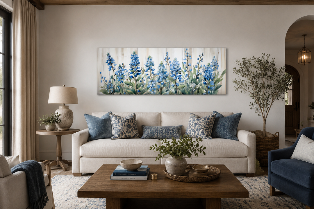 Blue wildflowers horizontal framed canvas wall art displayed above a sofa in a living room.