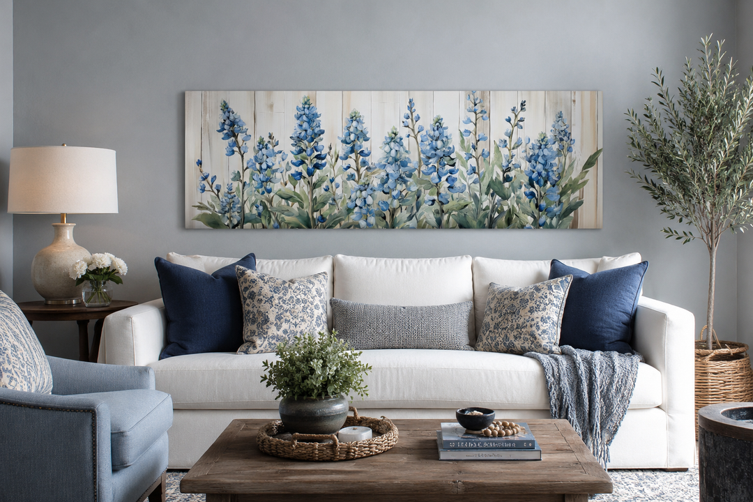 Blue wildflowers horizontal framed canvas wall art displayed above a white sofa in a living room.