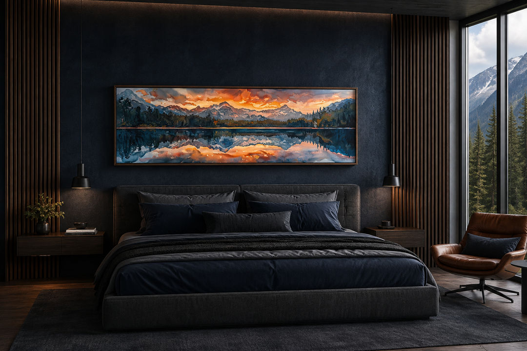 Panoramic framed canvas wall art of a sunset over a mountain lake hanging above a modern bed.