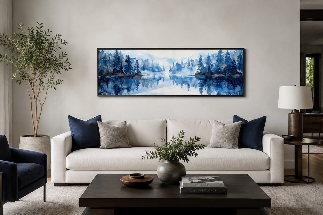 Navy blue lake long narrow horizontal landscape watercolor painting above a white couch.