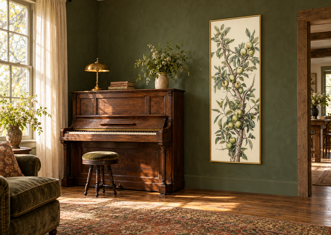 Long vertical framed canvas wall art featuring a botanical apple tree branch on a green wall.