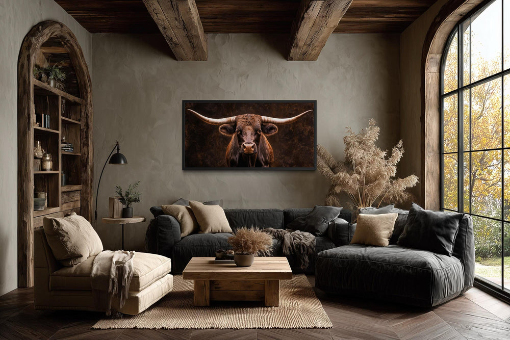 Extra large horizontal canvas print of a longhorn bull centered on a rustic living room wall.