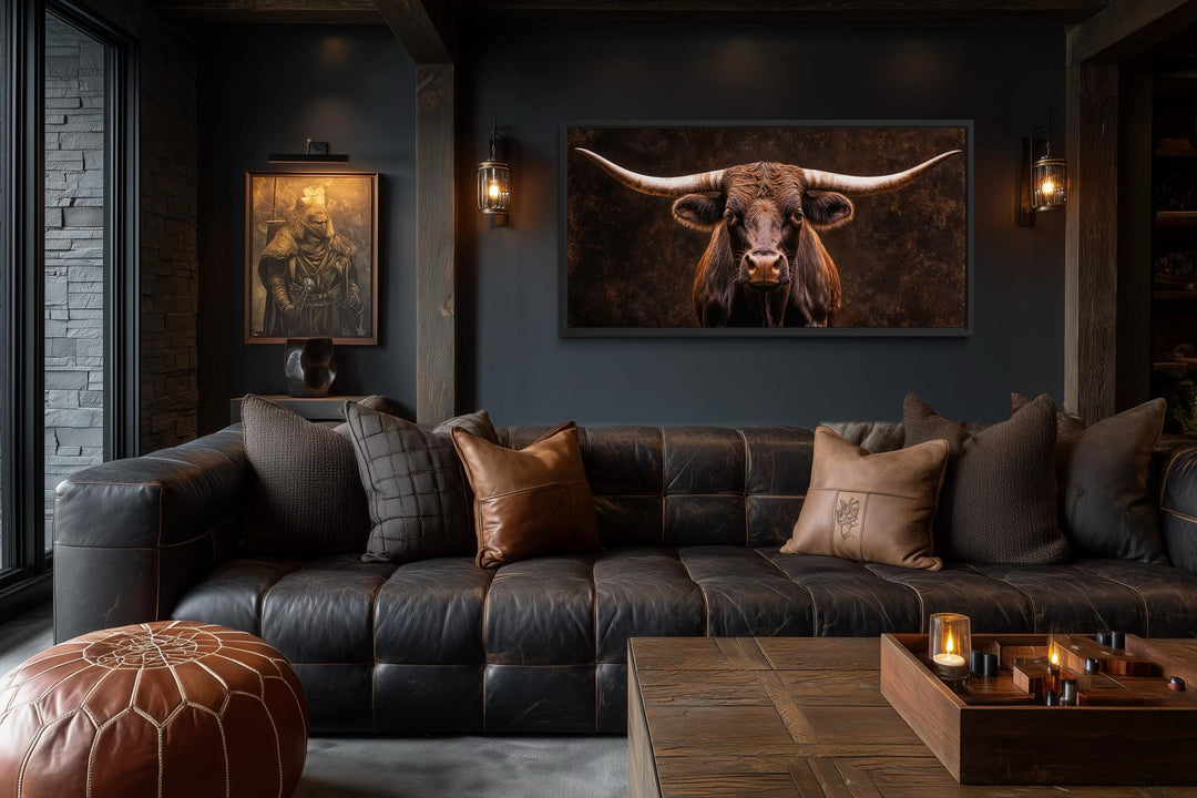 Extra large canvas print of a longhorn bull in a rustic, dark-toned living room setting.