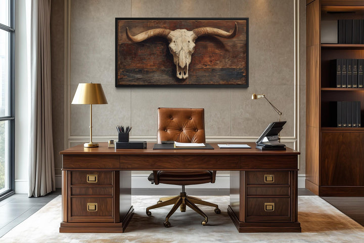 Extra large longhorn skull canvas wall art on a rustic brown background in a modern office setting.