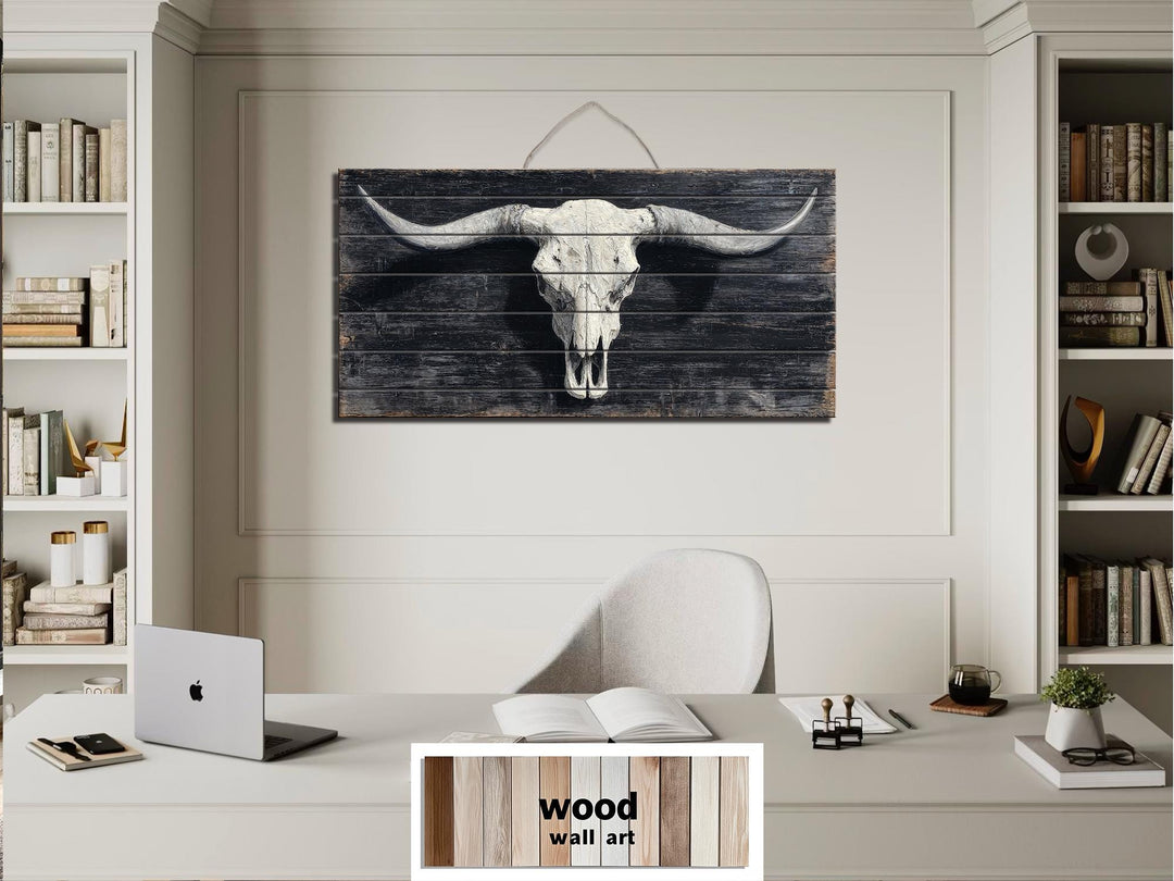 Horizontal wood wall art featuring a distressed longhorn bull skull print in a rustic office.