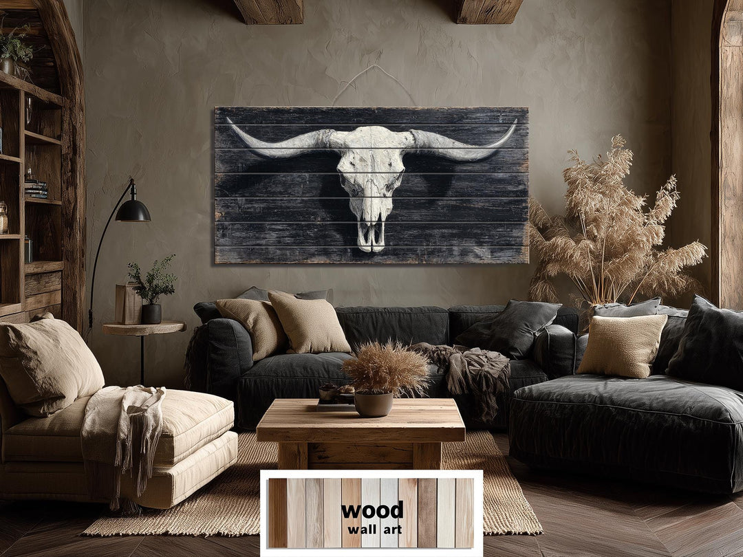 Longhorn skull wall art printed on horizontal distressed wood panels in a rustic living room.