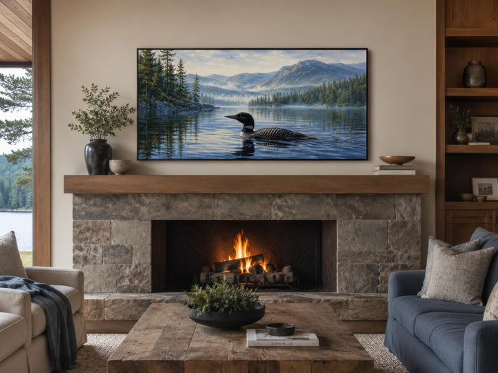 Loon wall art canvas of a common loon on a misty lake, displayed above a stone fireplace.