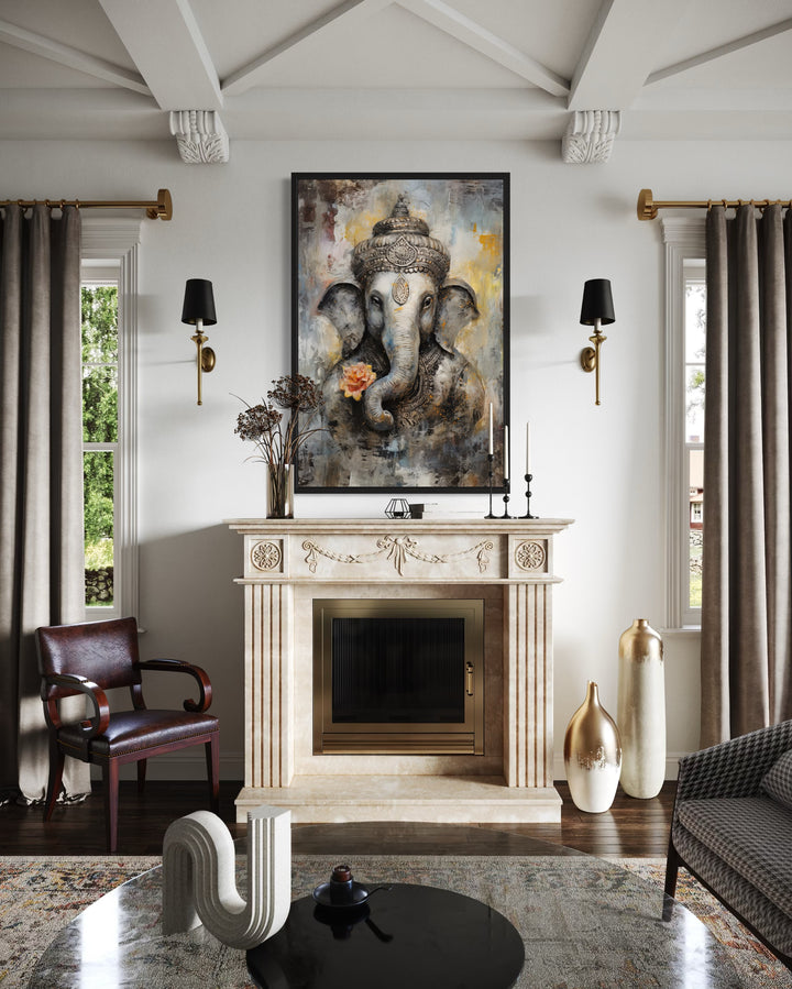 Lord Ganesha modern abstract framed canvas wall art hanging above a fireplace in a living room.
