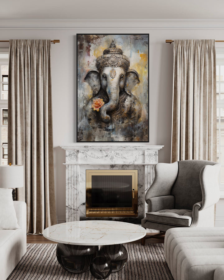Lord Ganesha modern abstract framed canvas wall art hanging above a marble fireplace in a living room