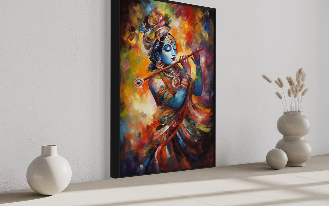 Colorful framed canvas wall art of Lord Krishna playing a flute in a vibrant, painterly style.