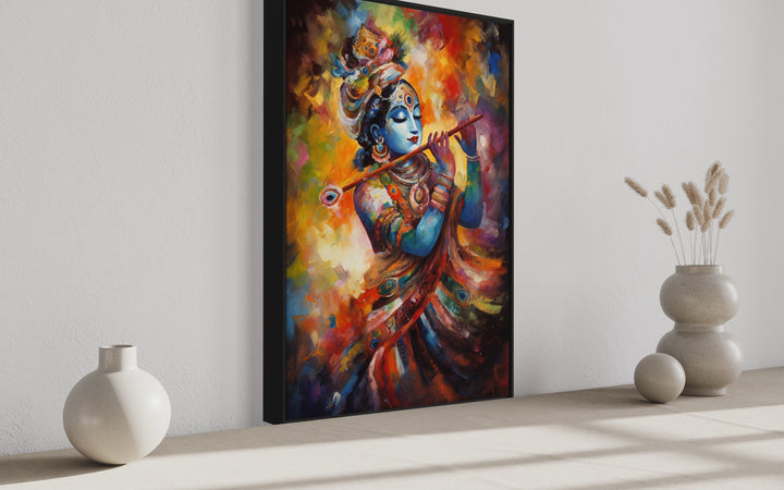 Colorful framed canvas wall art of Lord Krishna playing a flute in a vibrant, painterly style.