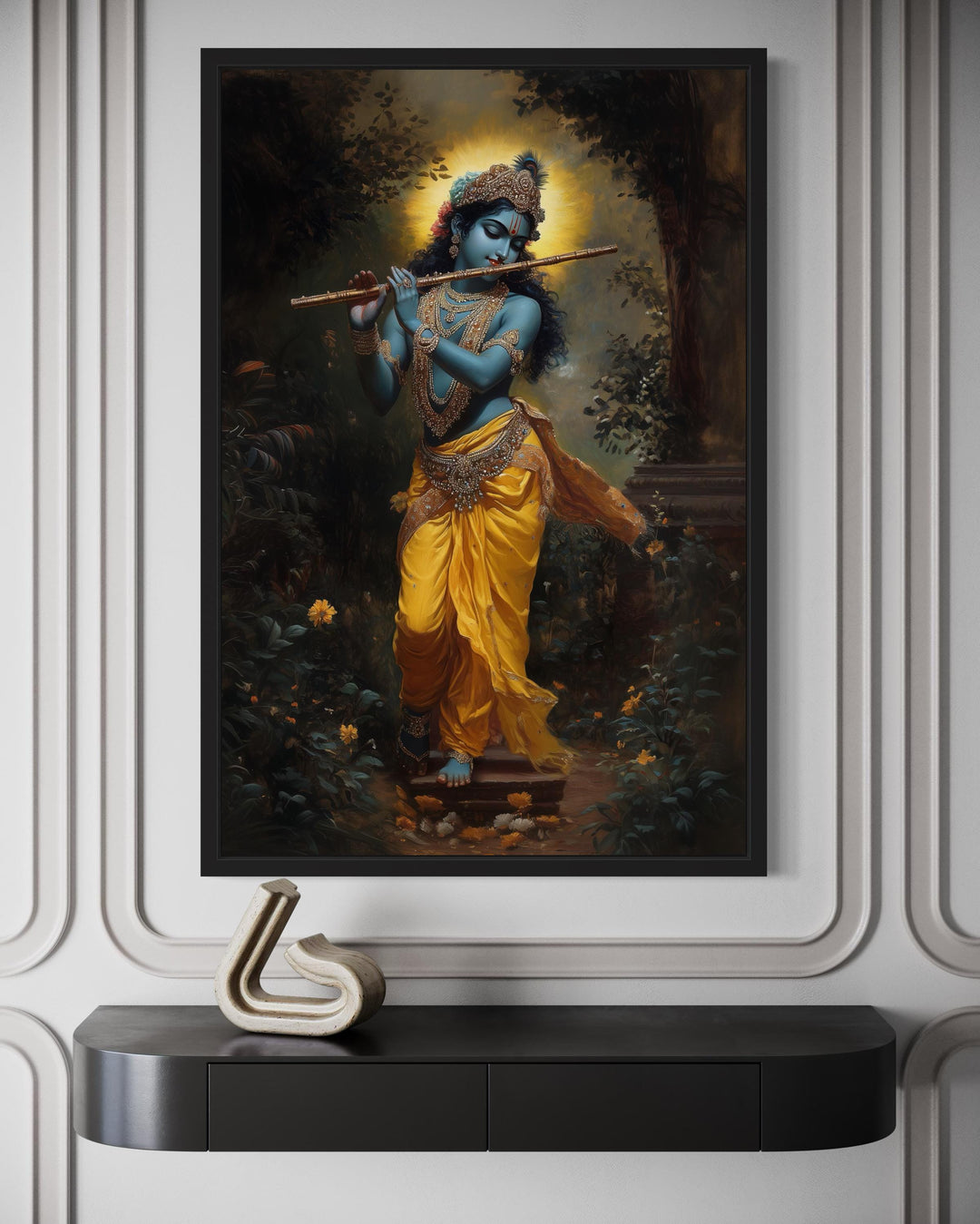 Lord Krishna playing a flute in a forest, framed canvas wall art above a black console table.