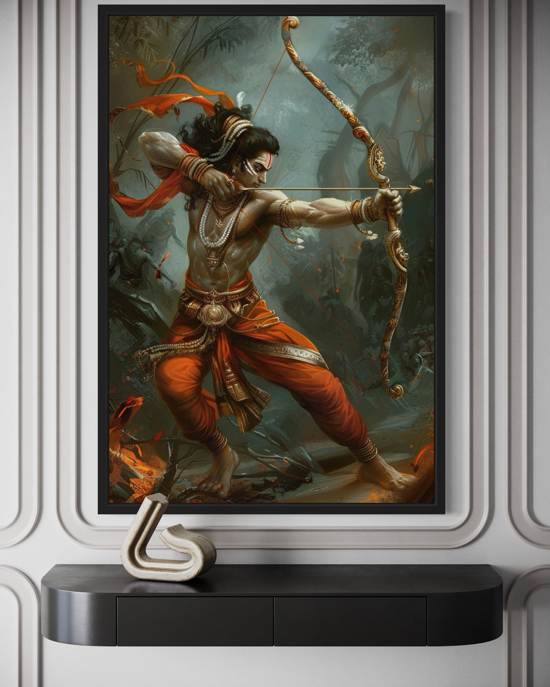 Lord Rama fighting demons with bow and arrow framed canvas wall art above a black console table.