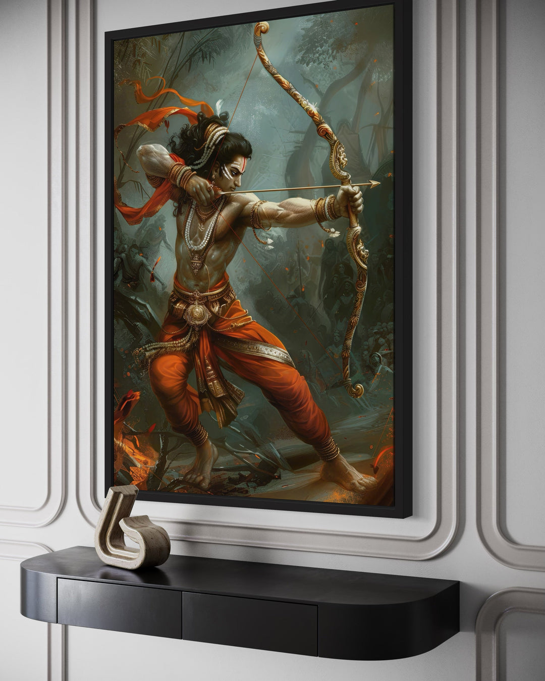 Lord Rama fighting demons with a bow and arrow on a framed canvas wall art above a black console.
