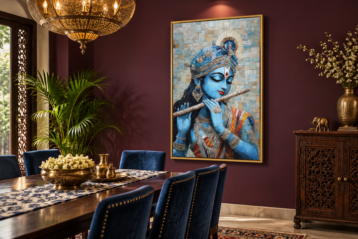 Lord Krishna mosaic canvas wall art playing a flute in a gold frame on a dark red dining room wall.