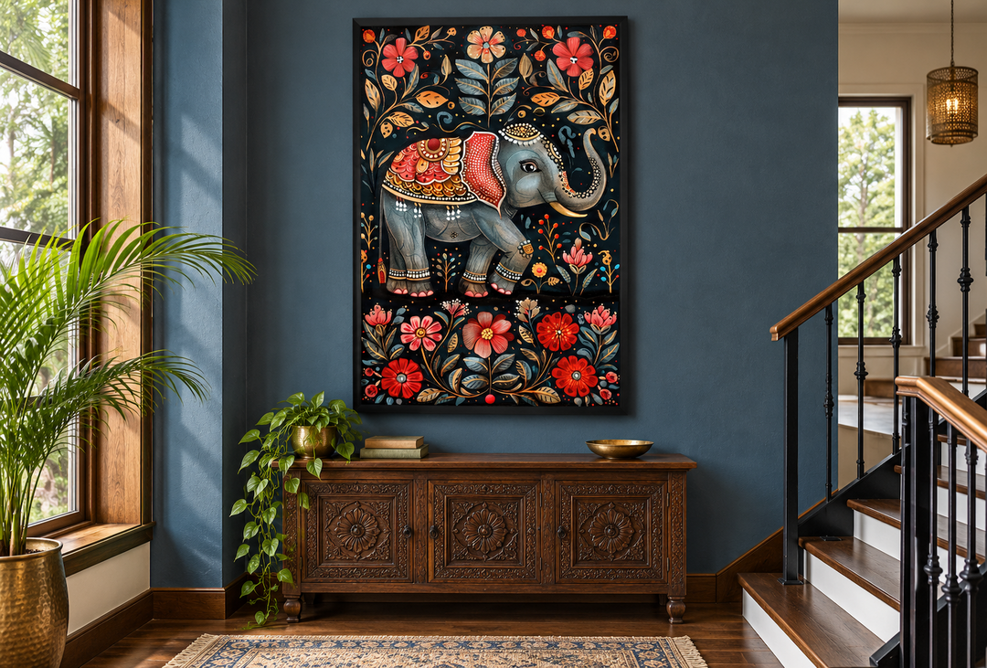 Madhubani style Indian elephant framed canvas wall art on a dark blue wall above a wooden console.