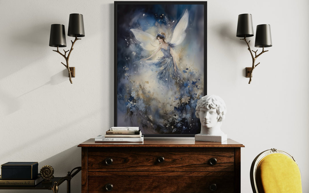 Framed wall art of a magical fairy dancing in an enchanted forest above a wooden dresser.