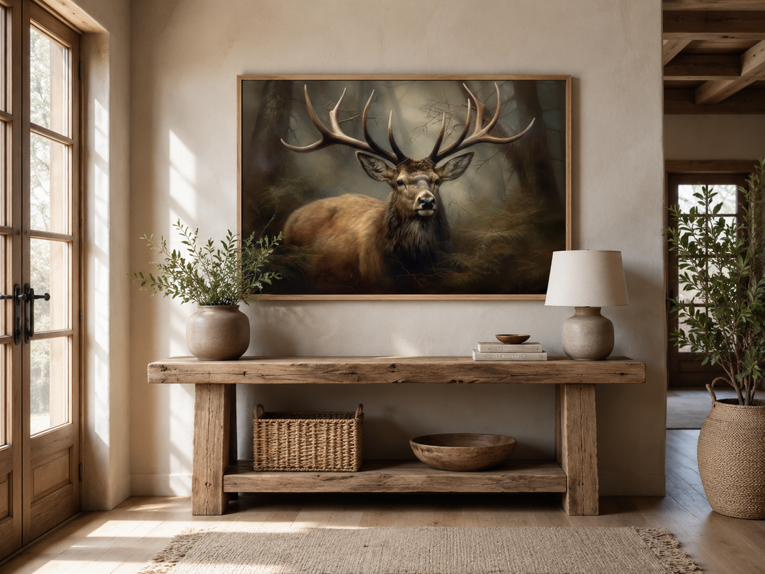 Majestic deer in foggy forest framed canvas wall art above a rustic wooden console table.