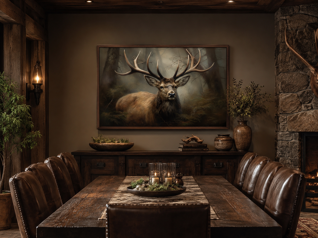 Framed canvas wall art of a majestic stag in a foggy forest, hung above a rustic dining table.