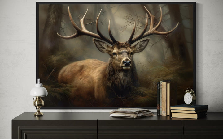 Majestic deer with large antlers in a foggy forest framed canvas wall art above a dark dresser.