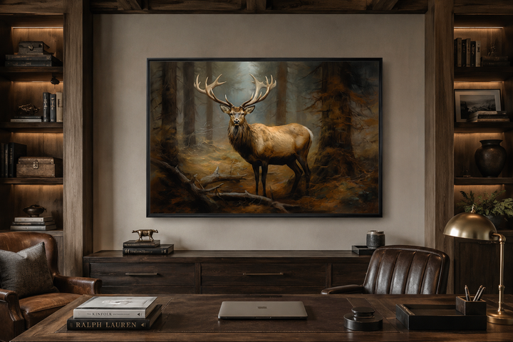 Framed canvas wall art of a majestic elk with large antlers in a misty fir tree forest.