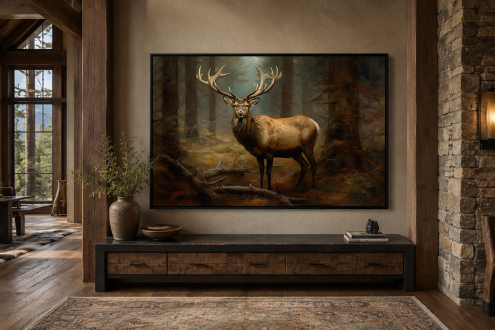 Framed canvas wall art of a majestic elk in a fir forest, displayed in a rustic cabin living room.