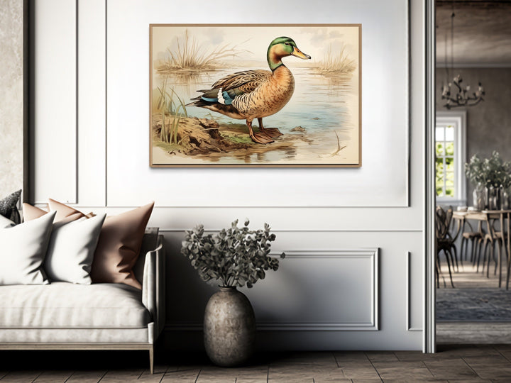 Mallard Duck Vintage Rustic Framed Canvas Wall Art hanging above a sofa in a neutral living room.
