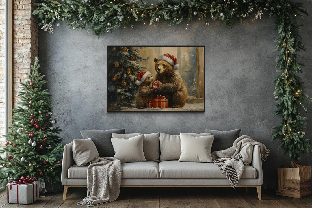 Mama bear and cub in Santa hats exchange gifts in a framed canvas art above a grey sofa.