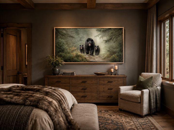 Mama bear and two cubs in a misty pine forest canvas wall art above a wooden dresser in a bedroom.