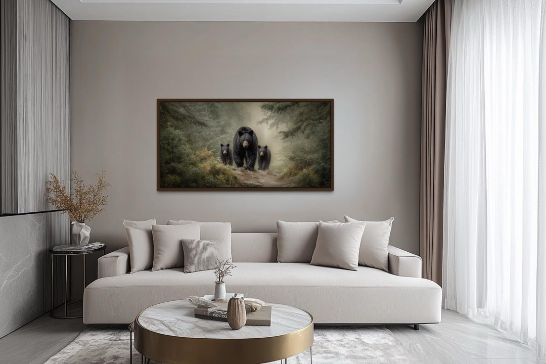 Mama Bear and Cubs in Pine Forest canvas wall art hanging above a modern sofa in a living room.