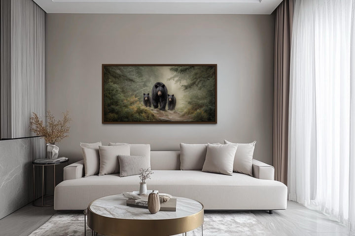 Mama Bear and Cubs in Pine Forest canvas wall art hanging above a modern sofa in a living room.