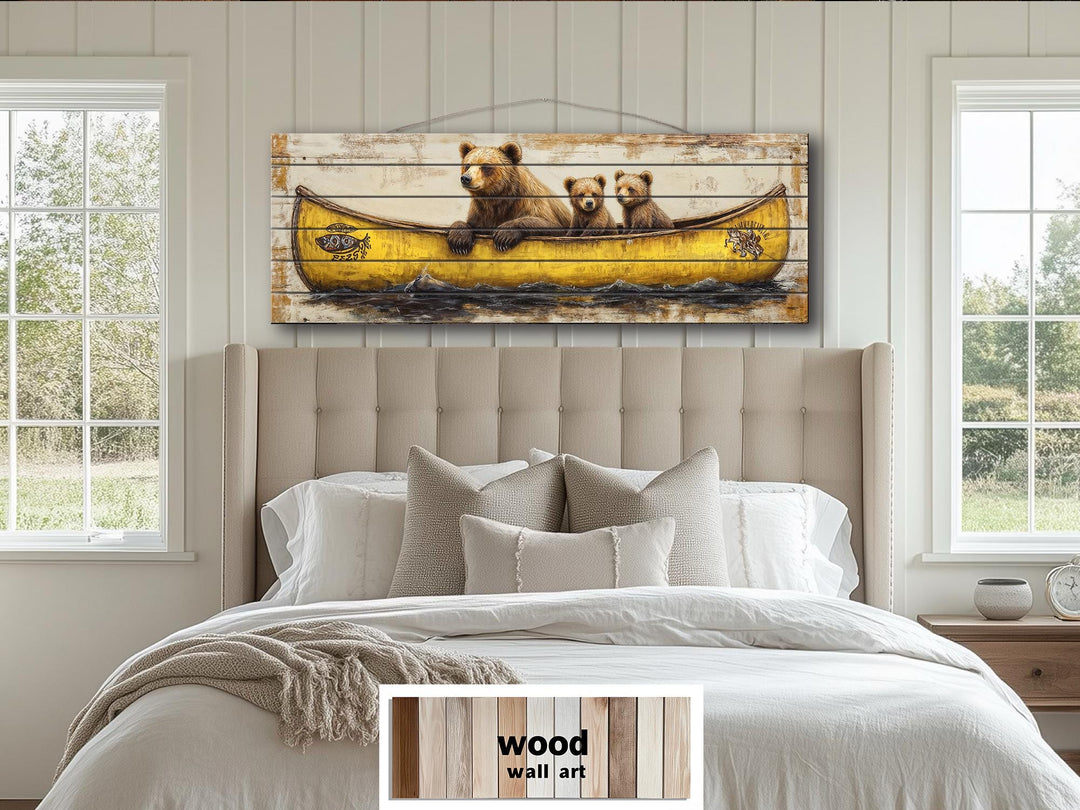 Mama Bear and cubs in a yellow canoe printed on horizontal wood planks above a bed.