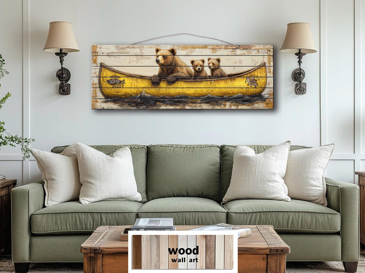 Mama bear and cubs in a yellow canoe printed on horizontal wood planks for rustic wall art.