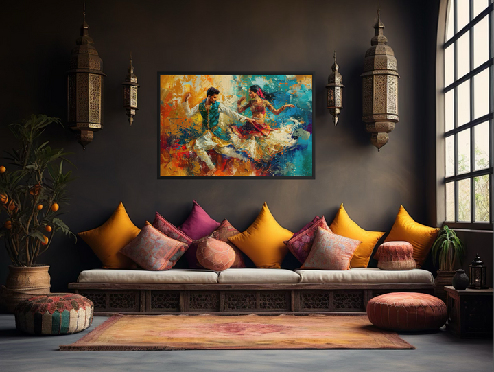 Framed canvas wall art of a man and woman dancing in vibrant Bollywood style on a dark wall.