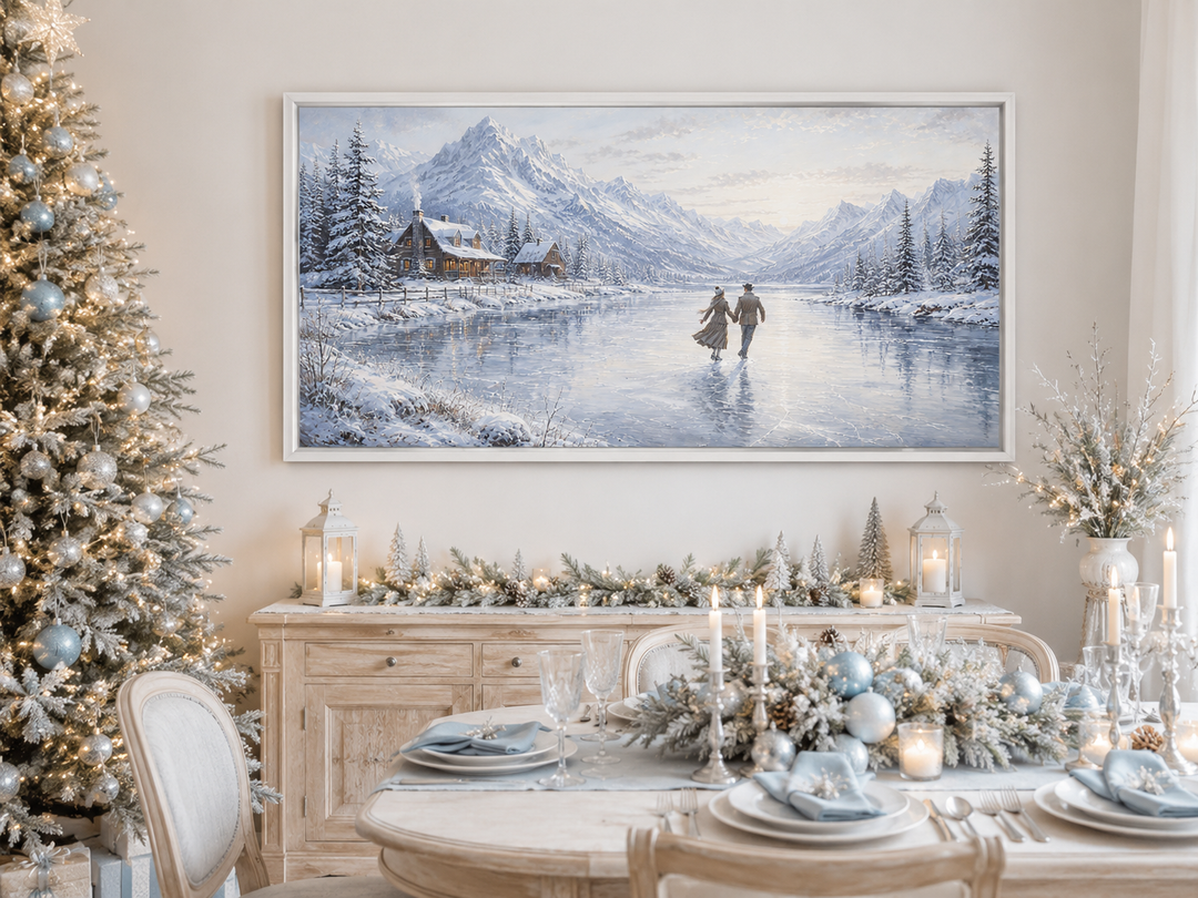 Framed canvas wall art of a man and woman skating on a frozen lake with snow-capped mountains.