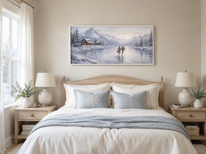 Framed canvas wall art of a man and woman skating on a frozen lake with snow-capped mountains.
